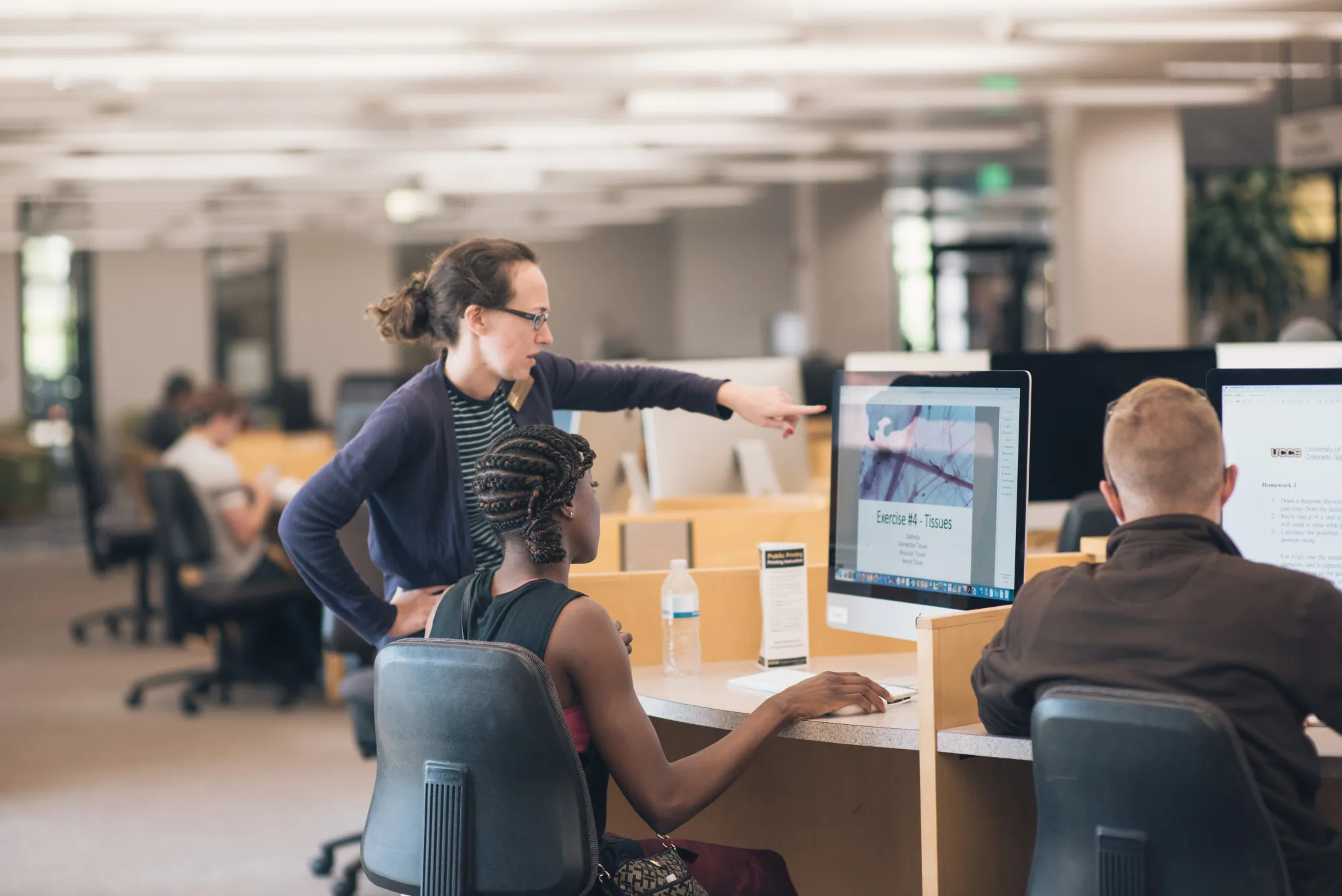 students working together in the library on campus